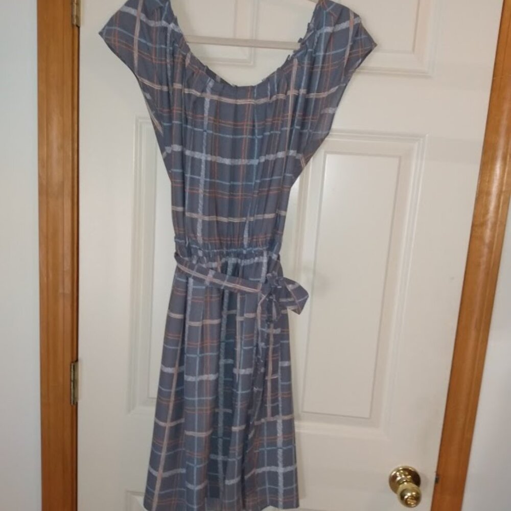 Lauren Conrad: Multi color cap sleeve dress with belt tie and flair bottom.